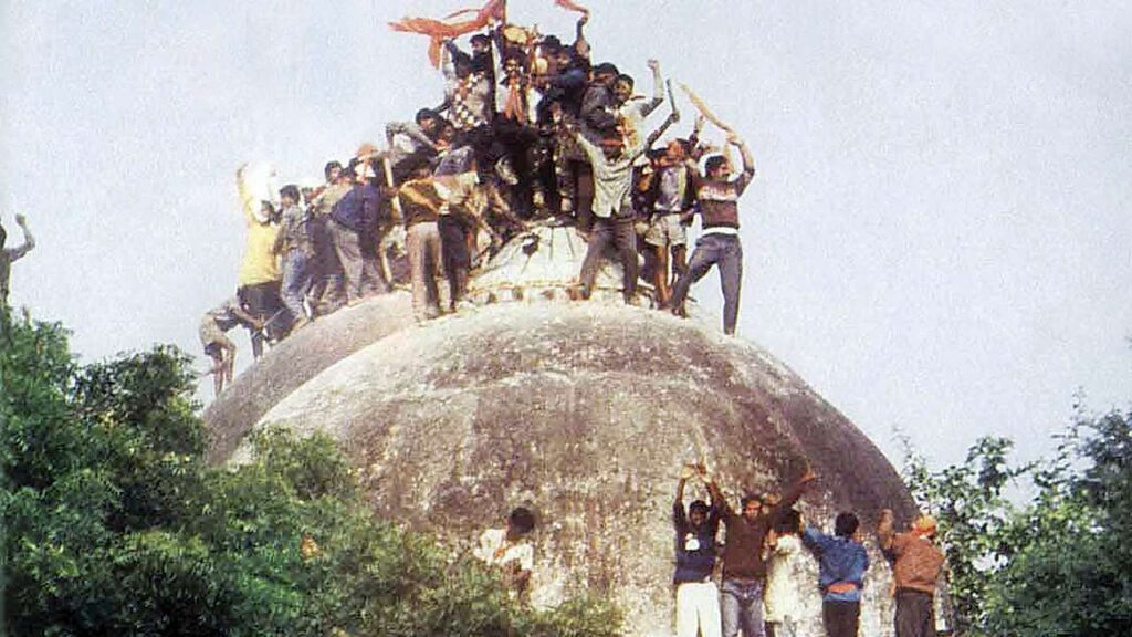 Right wing Hindu activists demolishing the Babri masjid in 1992.