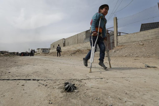A boy on crutches in Syria
