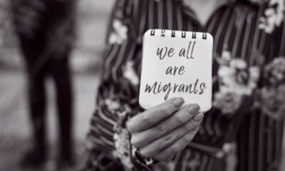 We are all migrants written on page