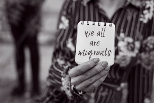 We are all migrants written on page