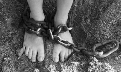 A child's feet in chains