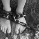 A child's feet in chains