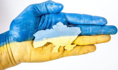 A hand colored in Ukraine's flag colors.
