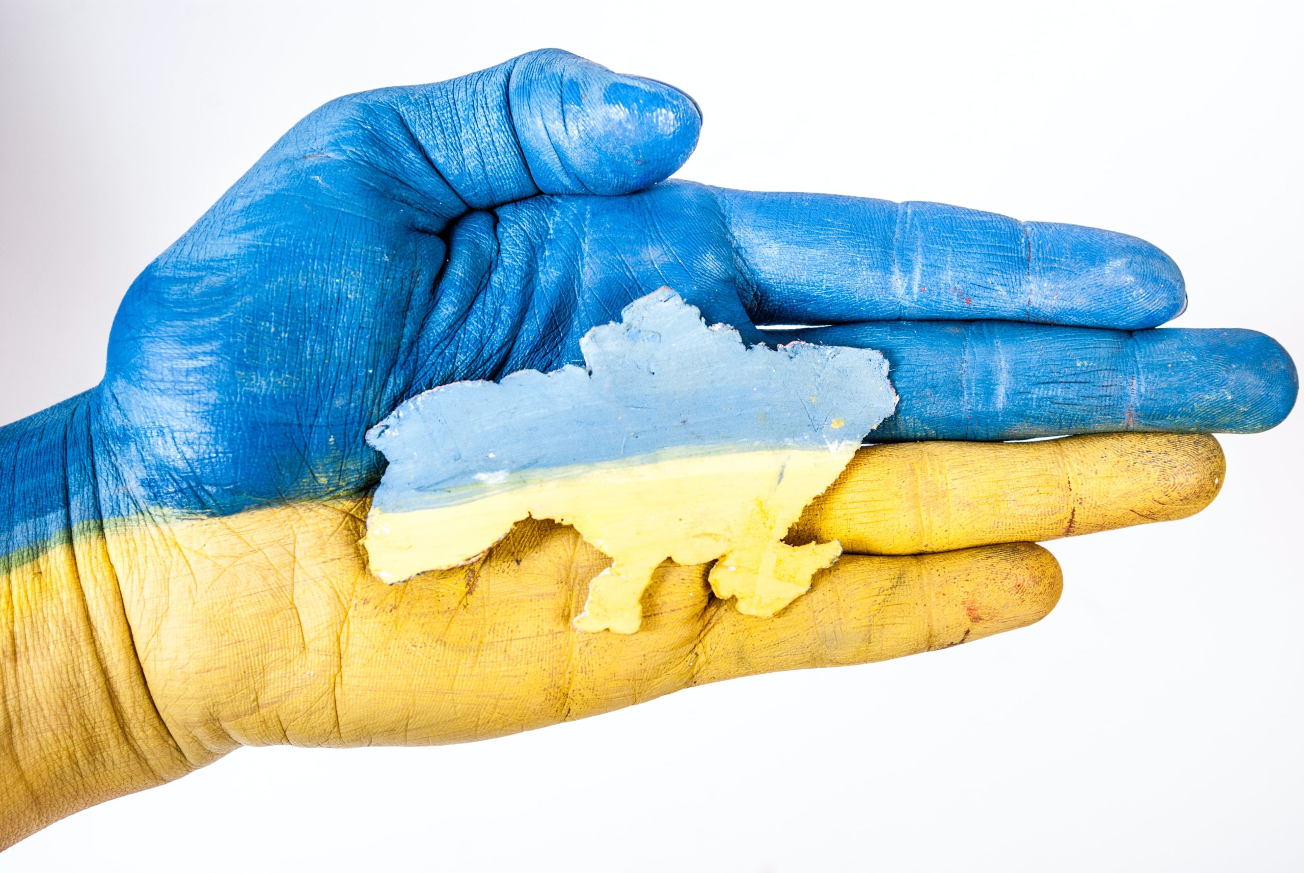 A hand colored in Ukraine's flag colors.