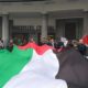 Supporters carrying the Palestinian Flag