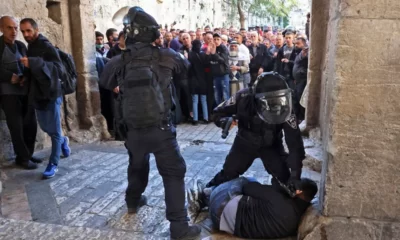 Israeli forces arresting a Palestinian
