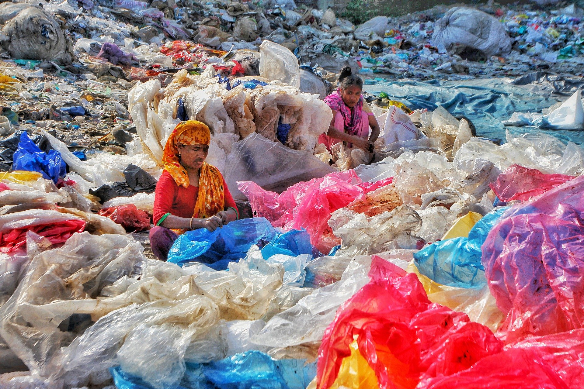 Women separating plastic trash.