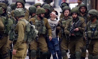 Israeli defense forces arresting a child