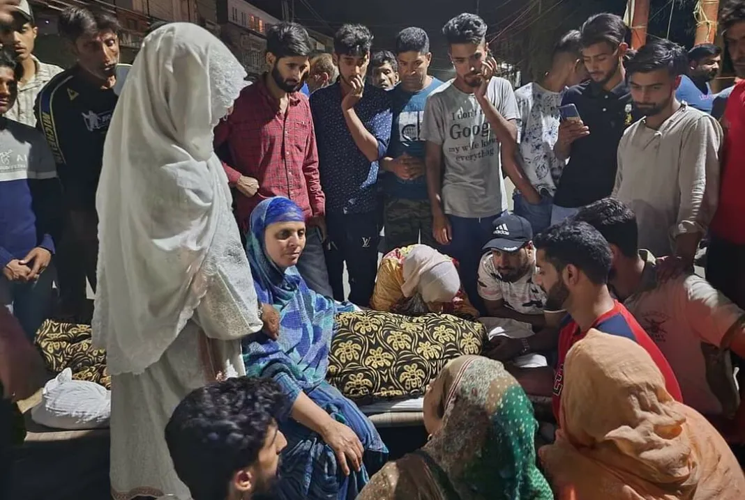 Family of 21-year-old Muslim staging a demonstration outside their residence in Srinagar