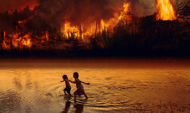 Two young children play in the water and behind them shows the forest fires burning to make way for deforestation in the Amazon threatening the ongoing climate change crisis.