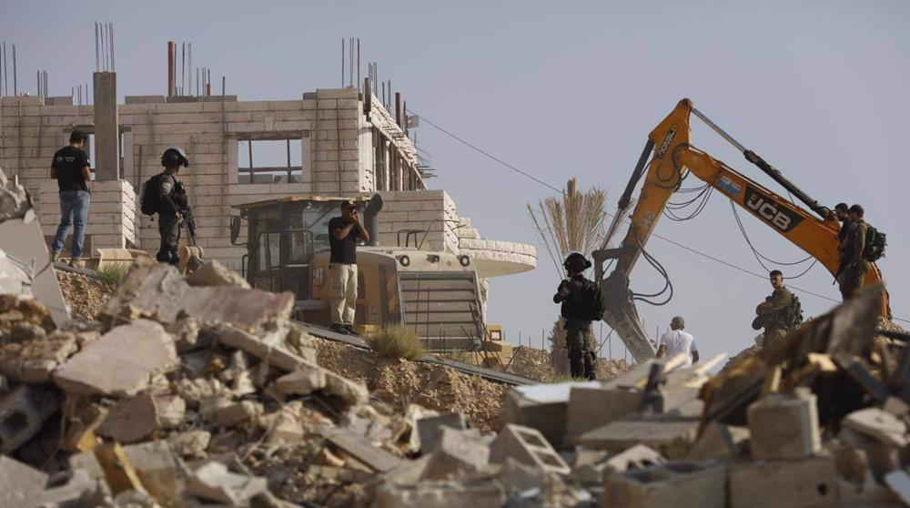 Israeli forces demolish a Palestinian house in Jerusalem